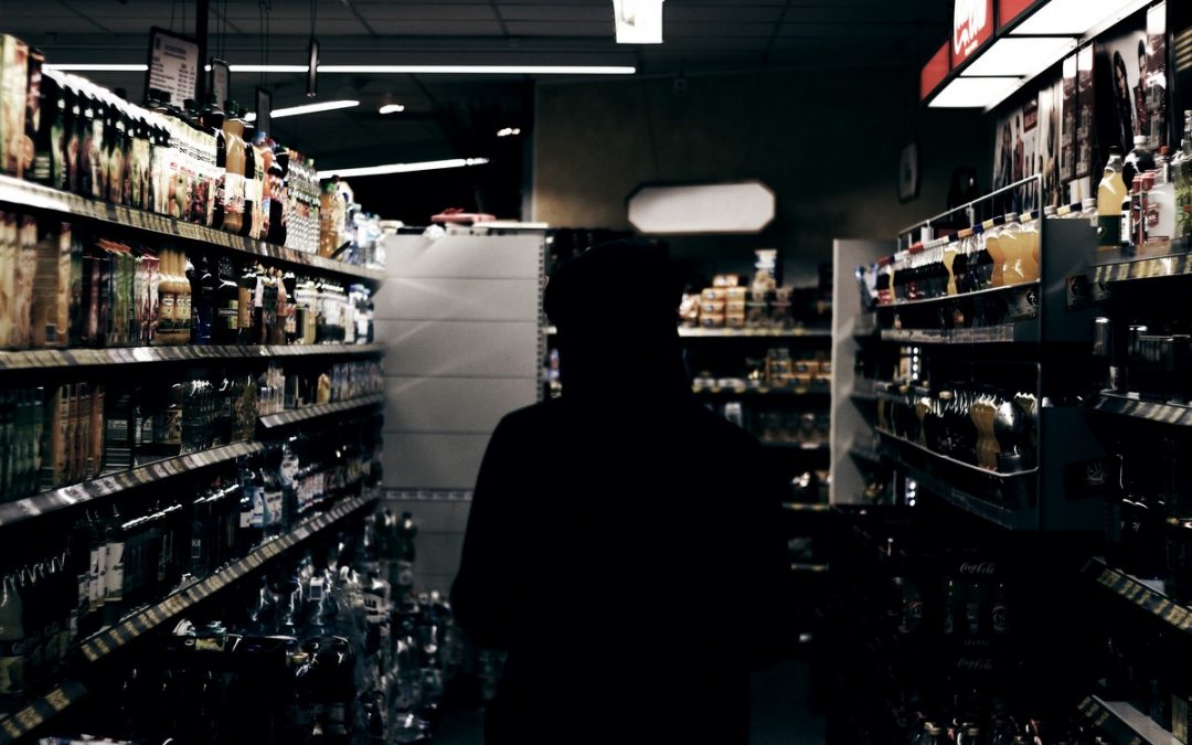 silhouette in a store aisle