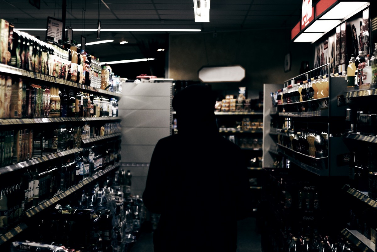 silhouette in a store aisle