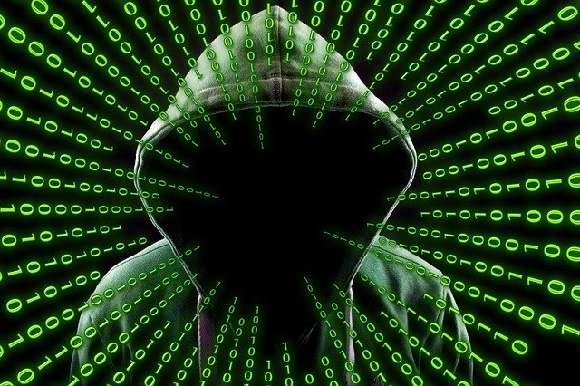 hacker threatening cybersecurity